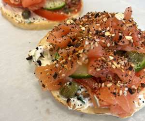 Salmon toasts with scallion cc tomato cucumber capers and ET bagel seeds 